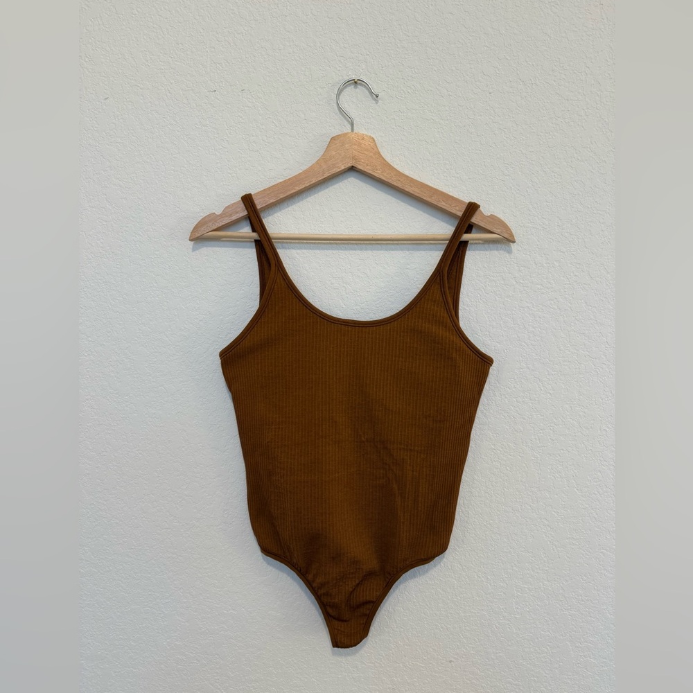Lululemon Ebb to Street Bodysuit *Light Support, B/C Cups
Copper Brown Size 6 - Picture 2 of 6